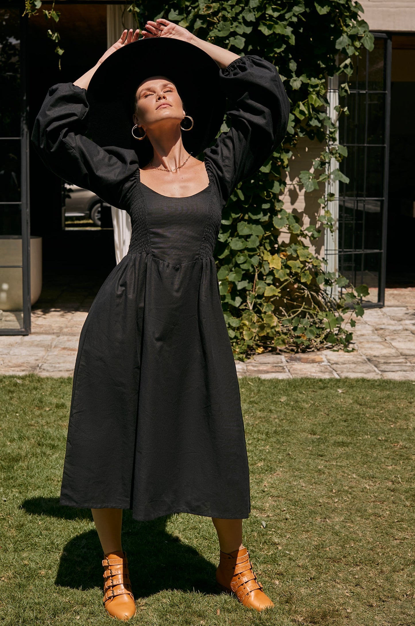 The Alila Smocked Linen Midi Dress